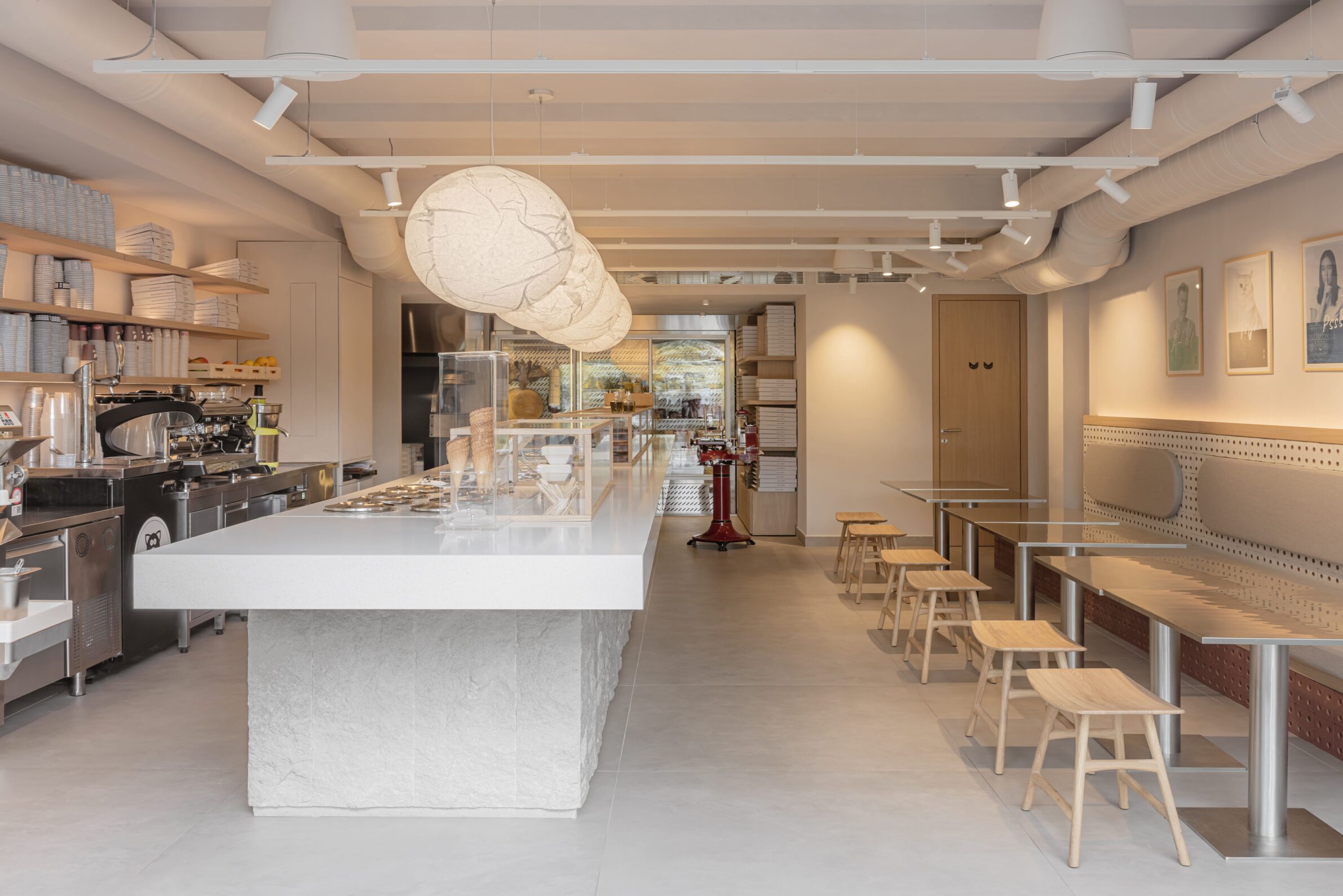 Restaurant MIG by Studio Fluid with an open counter connecting food preparation and dining in Belgrade, Serbia