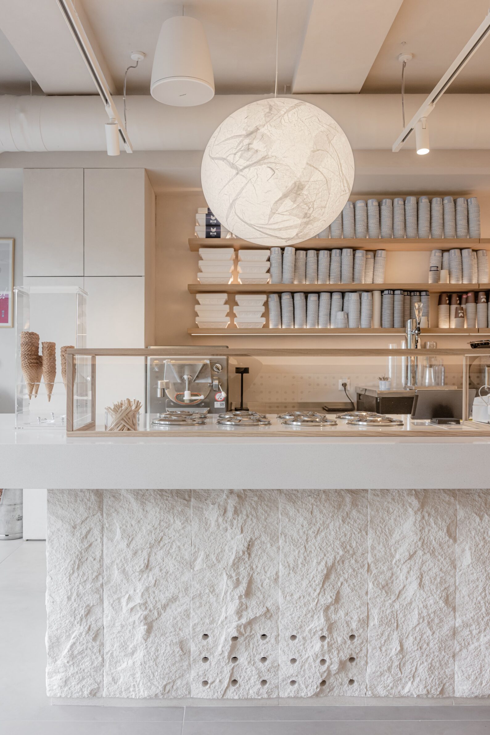 Restaurant MIG by Studio Fluid with an open counter connecting food preparation and dining in Belgrade, Serbia