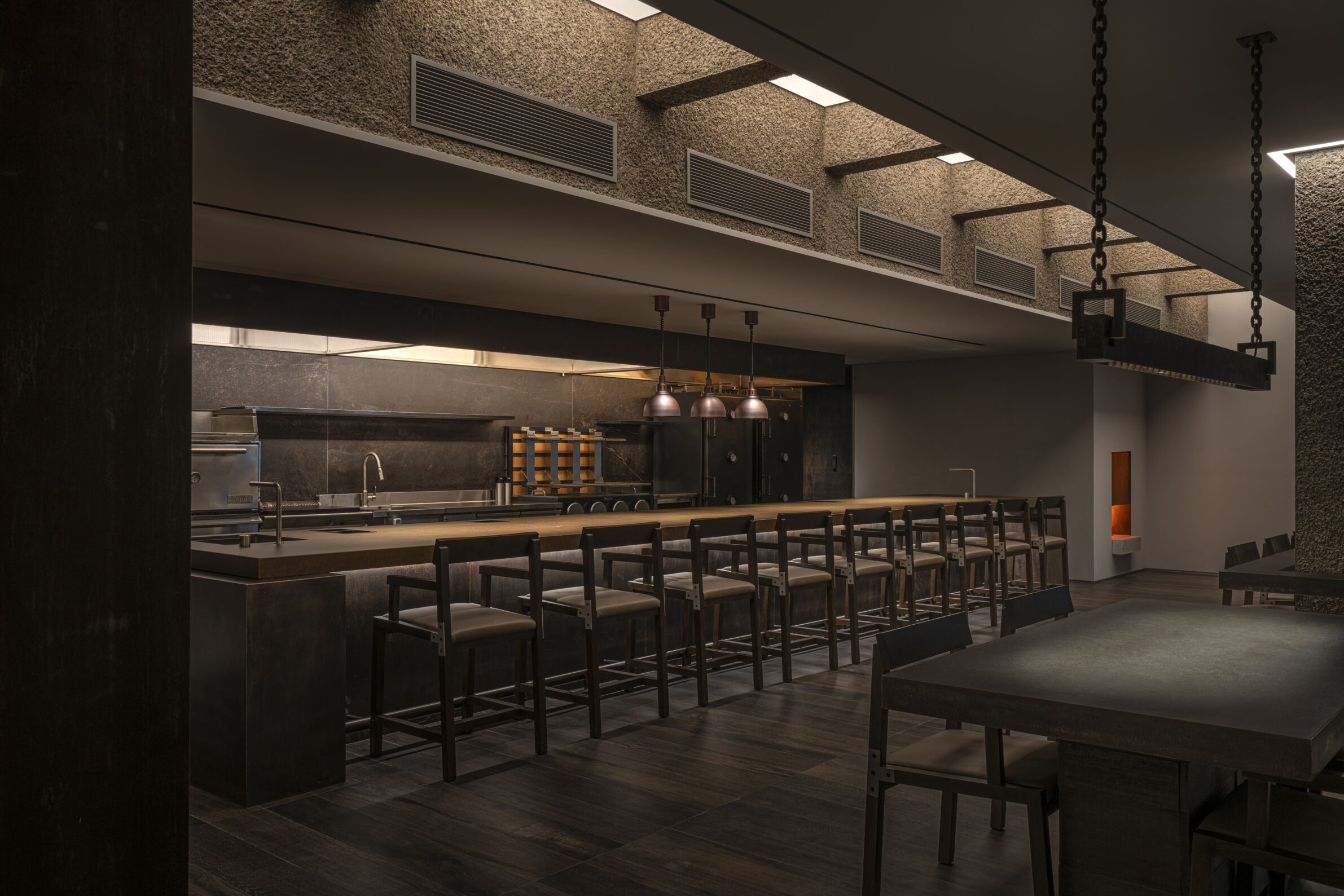 Imok Smoke Dining by Project Mark with dark concrete interiors, controlled lighting and fire elements in Seoul, South Korea