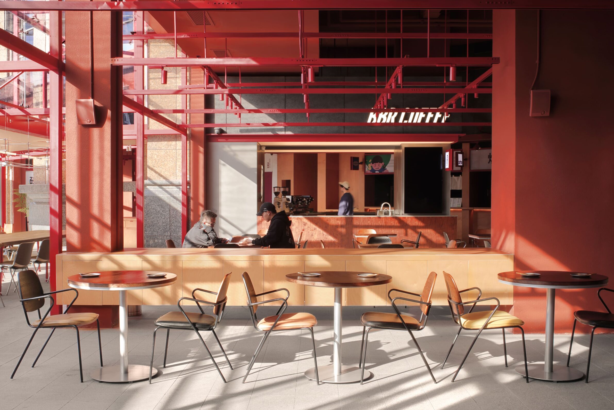 MEET&EAT Hengyang Store by LEL DESIGN STUDIO with a red steel framework connecting the restaurant to the street