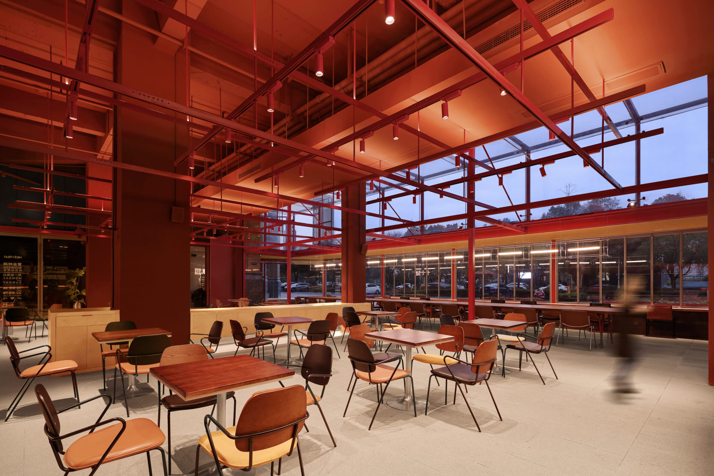MEET&EAT Hengyang Store by LEL DESIGN STUDIO with a red steel framework connecting the restaurant to the street