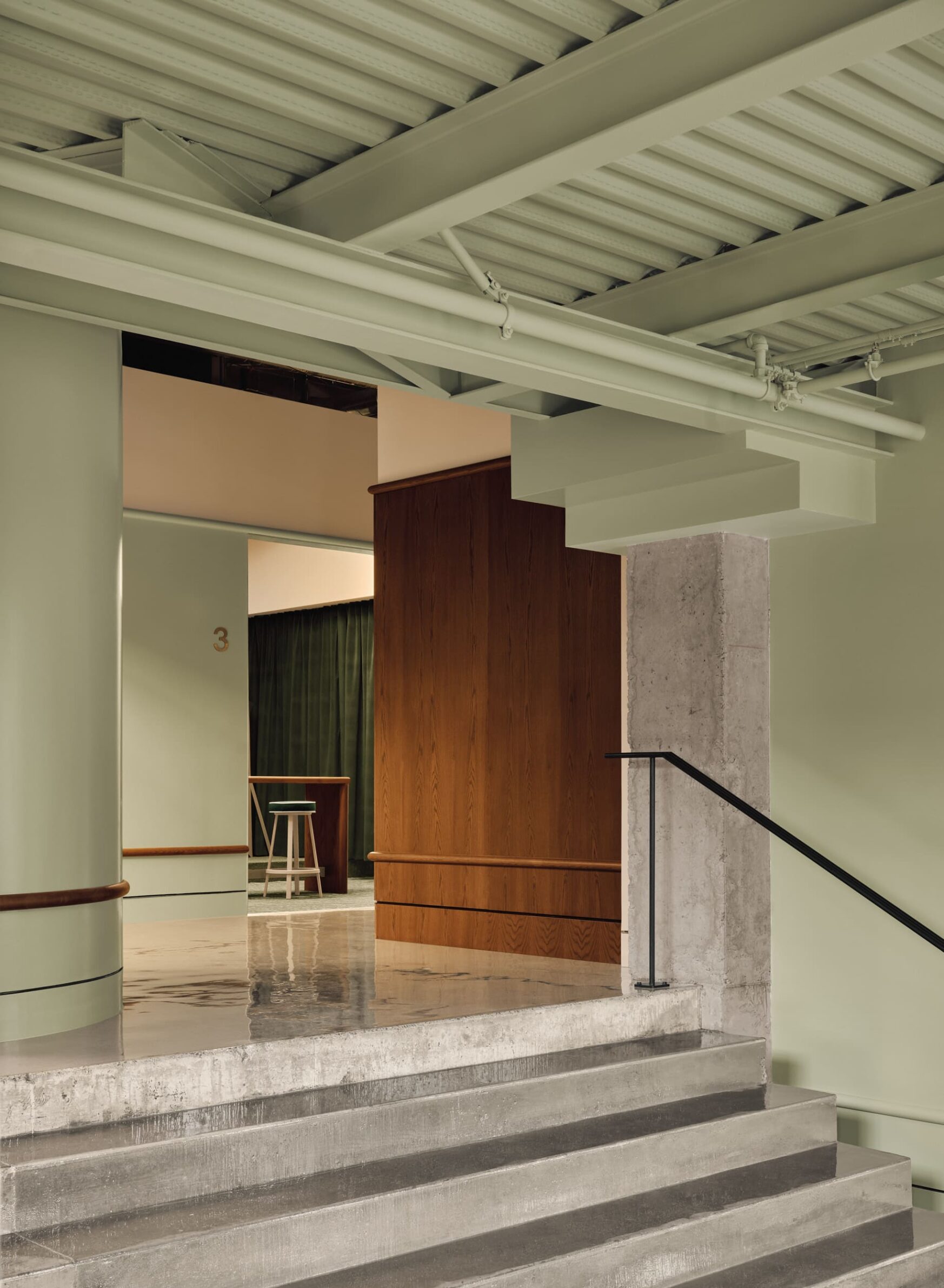 MUNI by IVY Studio inside Montreal’s historic Nordelec building, combining dining, bar and golf lounges
