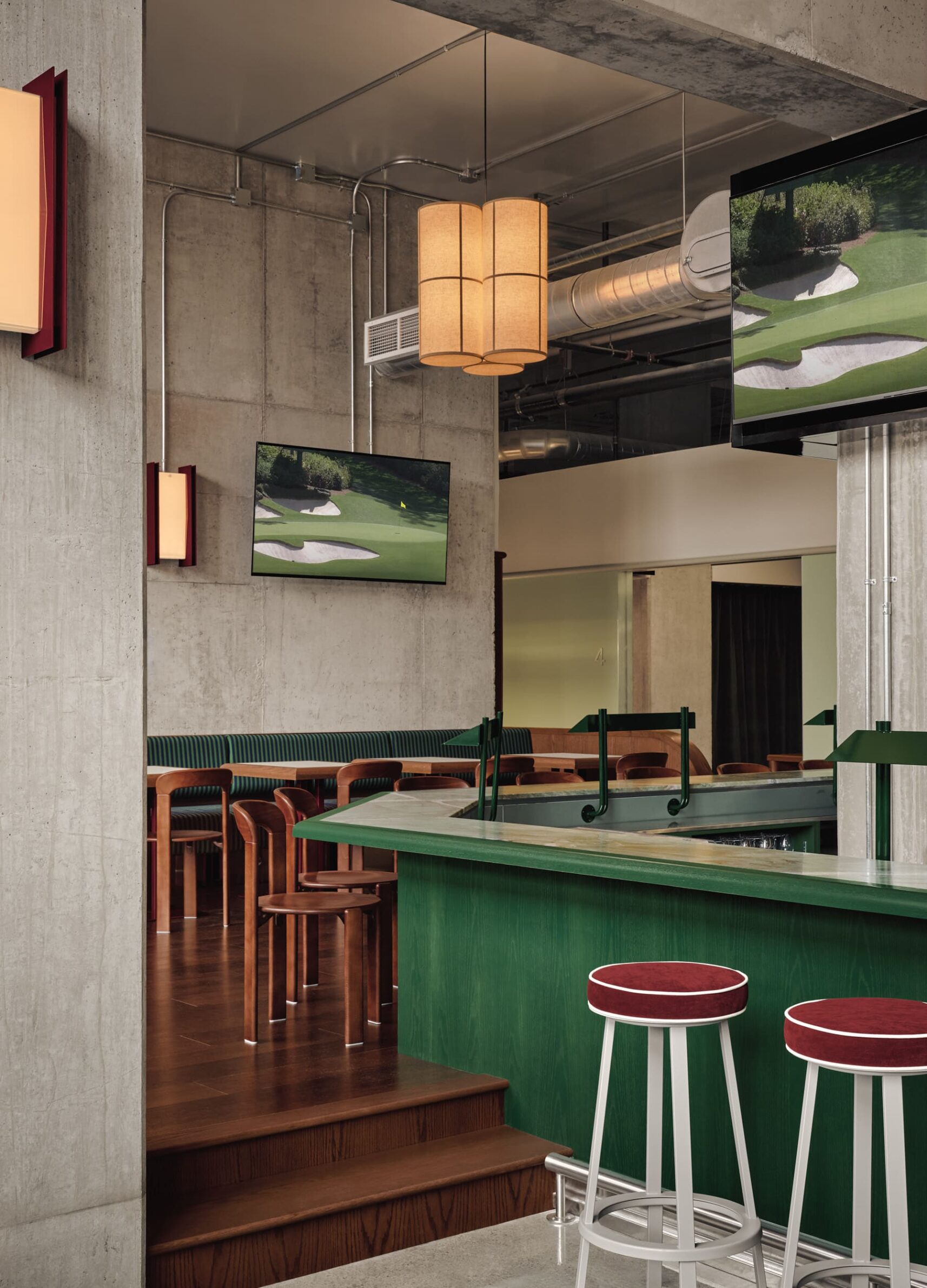 MUNI by IVY Studio inside Montreal’s historic Nordelec building, combining dining, bar and golf lounges
